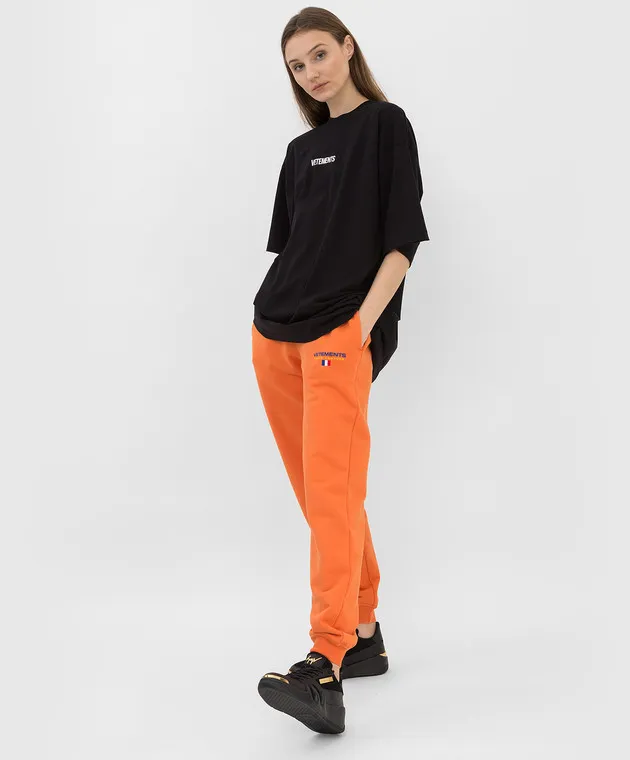 Vetements Orange joggers with logo
